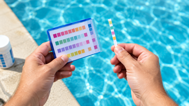 How to test pool water using a test strip dipped in pool water